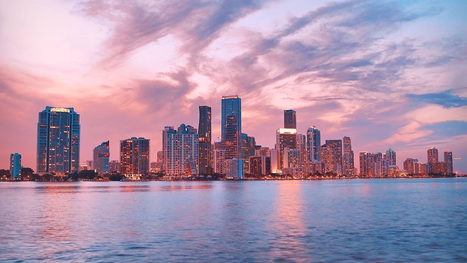 Miami skyline at sunset over the water